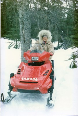 Ruby Leppke Gaede driving a snow machine on the Gaede-80 Homestead, Soldotna, Alaska 