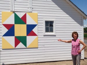 Naomi by one of her favorite barn quilts. 